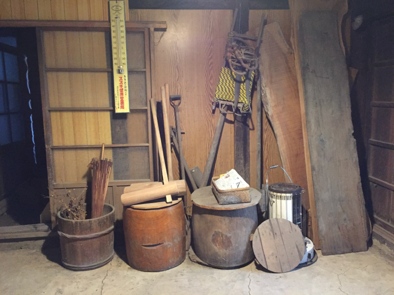Traditional wooden buckets and farming tools in old house