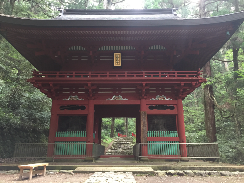 Red temple gate in forest