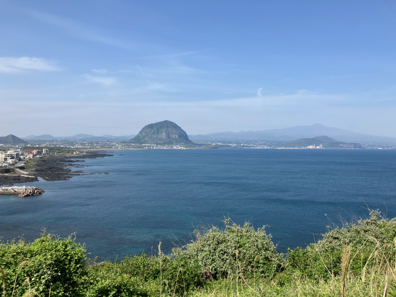 Coastal view of Sanbangsan across wide blue bay
